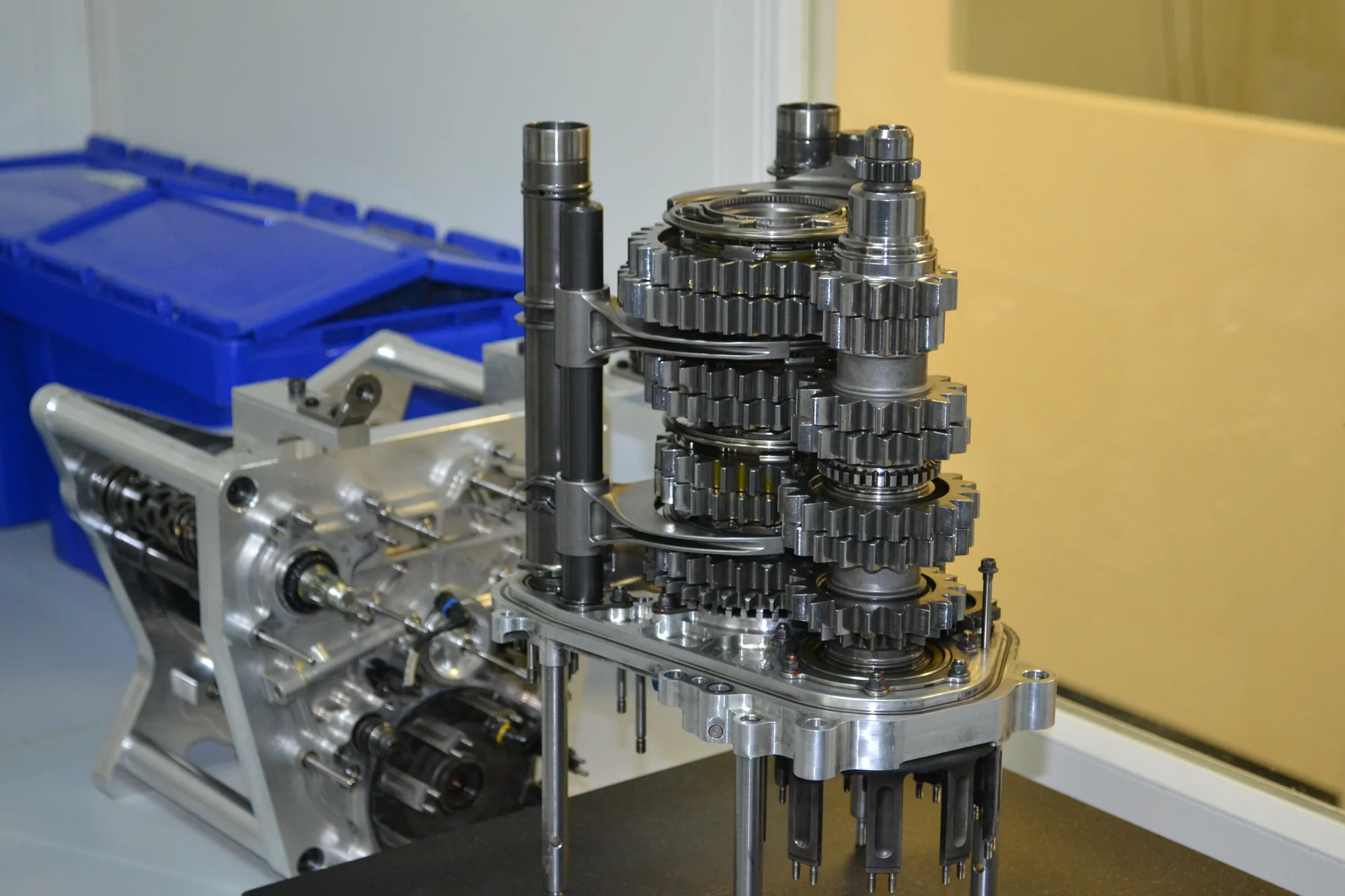 Exposed gearbox gears and shafts in a transmission assembly